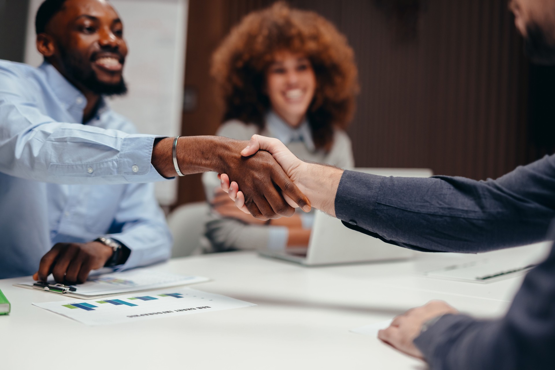 Business people shaking hands during a meeting in the office